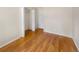 Bedroom with wood floors and closet with folding doors at 13784 W 67Th Way, Arvada, CO 80004