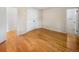 Bedroom with wood floors, bi-fold closet, and access to ensuite bathroom at 13784 W 67Th Way, Arvada, CO 80004