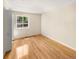 Bedroom with wood floors, closet with folding doors, and a double hung window at 13784 W 67Th Way, Arvada, CO 80004