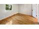 Bedroom with wood floors and a double hung window at 13784 W 67Th Way, Arvada, CO 80004