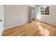 Bedroom with wood floors, bi-fold closet, and a double hung window at 13784 W 67Th Way, Arvada, CO 80004