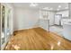 Bright dining area with hardwood floors, access to the kitchen, and sliding glass doors at 13784 W 67Th Way, Arvada, CO 80004