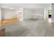 Spacious living room with new carpeting, hardwood floors, and plenty of natural light at 13784 W 67Th Way, Arvada, CO 80004