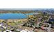 An aerial view of a property near a lake, lush greenery and a picturesque cityscape at 1634 N Sheridan Blvd # 202, Denver, CO 80204