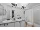 Functional bathroom featuring dual sinks, granite countertop, and a shower-tub combination at 10383 Erin Pl, Lone Tree, CO 80124