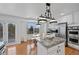 Bright kitchen with an island and stainless steel appliances is conveniently located near breakfast nook at 10383 Erin Pl, Lone Tree, CO 80124