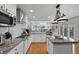 Modern kitchen featuring granite countertops, stainless steel appliances, and white cabinetry at 10383 Erin Pl, Lone Tree, CO 80124