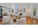 Bright and airy living room with a fireplace, high ceilings, and an open floor plan at 10383 Erin Pl, Lone Tree, CO 80124