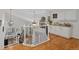 Open staircase leads to the living room and overlooks the kitchen at 10383 Erin Pl, Lone Tree, CO 80124