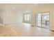 Bright and airy living room with wood floors, recessed lighting, and access to the patio at 7357 S Yank Ct, Littleton, CO 80127