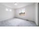 Bright bedroom with neutral carpet, natural light from a window, and white trim at 22103 E 38Th Pl, Aurora, CO 80019
