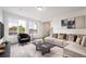 Comfortable living room showcasing stylish furniture, large windows, and modern decor at 22103 E 38Th Pl, Aurora, CO 80019