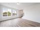 Bright open living room with hardwood floors and abundant natural light from windows at 22103 E 38Th Pl, Aurora, CO 80019