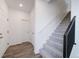 Staircase with carpet and modern metal railing at 22103 E 38Th Pl, Aurora, CO 80019