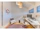 Bright home office with white walls, hardwood floors, a large window, and modern decor at 21577 Mountsfield Dr, Golden, CO 80401