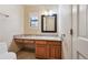 Bathroom featuring a marble countertop and wood cabinets at 2609 S Quebec S St # 20, Denver, CO 80231