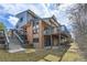 Back exterior view of home featuring multi-level deck and patio at 2609 S Quebec S St # 20, Denver, CO 80231