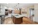 Well-lit kitchen with a large center island, stainless appliances and granite countertops at 2609 S Quebec S St # 20, Denver, CO 80231