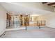 Spacious living room showcasing a railing, a dining area, and neutral carpeting at 2609 S Quebec S St # 20, Denver, CO 80231