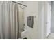 Clean bathroom featuring a shower with curtain, and a towel rack, for a refreshing and functional space at 11307 Navajo Cir # A, Westminster, CO 80234
