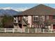 Beautiful multi-story home featuring a well-manicured yard and mountain views in the background at 11307 Navajo Cir # A, Westminster, CO 80234