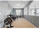 Bright home gym featuring weightlifting equipment and large windows for natural light and ventilation at 11307 Navajo Cir # A, Westminster, CO 80234