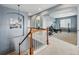 Upstairs hallway leading to bonus room featuring workout equipment and natural light at 11307 Navajo Cir # A, Westminster, CO 80234