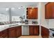 Bright kitchen with white countertops, stainless steel appliances, and open living space at 11307 Navajo Cir # A, Westminster, CO 80234