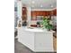 Bright kitchen with white counters, stainless steel sink, and warm wood cabinetry at 11307 Navajo Cir # A, Westminster, CO 80234