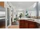 Open-concept kitchen features a pantry and views to dining room and living room at 11307 Navajo Cir # A, Westminster, CO 80234