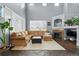 Spacious living area with high ceilings, large windows, a fireplace, and stylish decor for comfort and elegance at 11307 Navajo Cir # A, Westminster, CO 80234