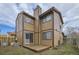 Two-story home exterior displaying a deck, lawn and backyard with privacy fence at 11753 Pennsylvania St, Northglenn, CO 80233