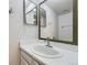 Bathroom featuring modern sink, mirror and fixtures with neutral paint color at 11753 Pennsylvania St, Northglenn, CO 80233