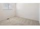 Bright bedroom featuring plush carpet, a window, and neutral-colored walls at 11753 Pennsylvania St, Northglenn, CO 80233