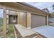 Home exterior featuring attached garage, landscaping and address numbers above the portico at 11753 Pennsylvania St, Northglenn, CO 80233