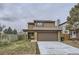 Charming two-story home with a brick facade and attached garage at 11753 Pennsylvania St, Northglenn, CO 80233