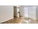 Living area with sliding door, hardwood floors and lots of natural light at 11753 Pennsylvania St, Northglenn, CO 80233