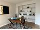 Bright office space featuring a wooden desk and stylish built-in shelving at 11753 Pennsylvania St, Northglenn, CO 80233