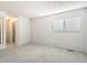 Carpeted room, bathed in natural light, offering a serene and spacious ambiance at 11753 Pennsylvania St, Northglenn, CO 80233