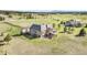 Aerial view of a home in a well-manicured community featuring lush greenery and open space at 1236 Castlecombe Ln, Monument, CO 80132