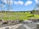 Backyard view with chairs, rock garden, and beautiful views of the surrounding landscape at 1236 Castlecombe Ln, Monument, CO 80132