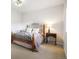 Neutral bedroom with ornamental iron bed frame, plush carpeting, and ample natural light at 1236 Castlecombe Ln, Monument, CO 80132