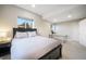 Neutral bedroom with a window providing natural light, carpet flooring, and black furniture at 1236 Castlecombe Ln, Monument, CO 80132