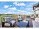 Outdoor deck boasts seating, a fire pit, and a golf course view at 1236 Castlecombe Ln, Monument, CO 80132