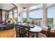 Charming dining area with bench seating and large windows with views of the golf course at 1236 Castlecombe Ln, Monument, CO 80132