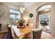 Inviting dining room features stylish light fixture and flows seamlessly into adjacent rooms at 1236 Castlecombe Ln, Monument, CO 80132