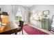 Home office with a large window and comfortable workspace at 1236 Castlecombe Ln, Monument, CO 80132