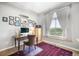 Bright home office with large window and views of a golf course and wall décor at 1236 Castlecombe Ln, Monument, CO 80132