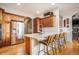 Kitchen with stainless steel appliances, island seating, and granite countertops at 1236 Castlecombe Ln, Monument, CO 80132