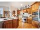 Well-lit kitchen offers modern appliances and a center island at 1236 Castlecombe Ln, Monument, CO 80132